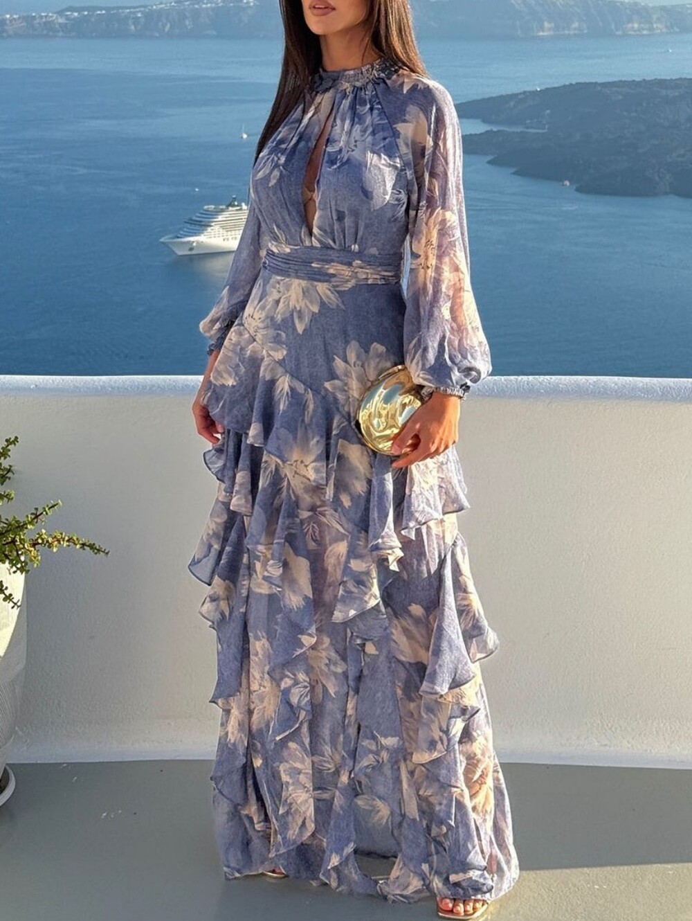 Elegant long maxi dress with a floral print in soft blue and lavender shades
